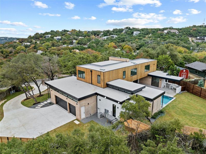 Situated lke a citadel atop a gentle slope from street level. Home, pool and backyard rest on level ground