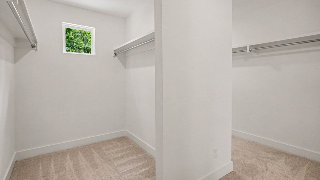 Primary closet with built-in shelves Primary closet with built-in shelves
