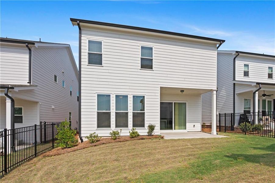 Exterior details and patio area of a home in Palisades Single Family, Cumming (Image 28).