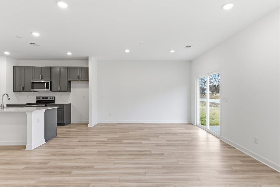 A kitchen with white walls.