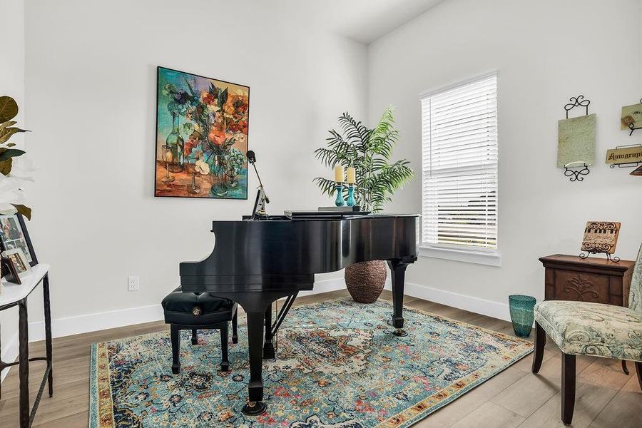 Bright interior space featuring light wood-finish flooring, and French doors