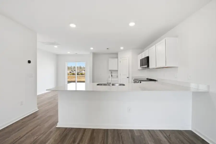A kitchen with white cabinets. A kitchen with white cabinets.