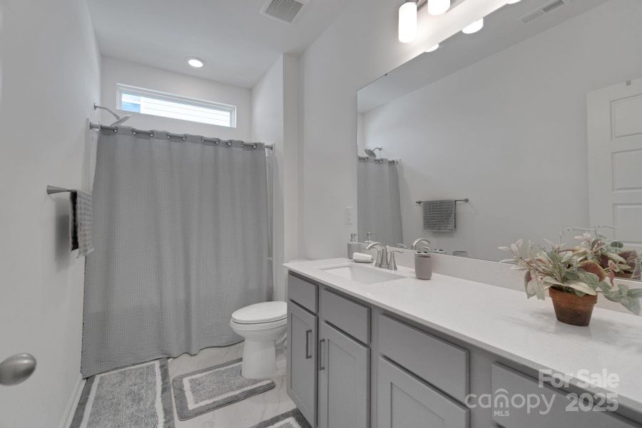 Furnished interior view inside a new home in The Hills, Huntersville (Image 12).