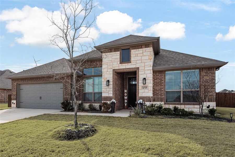 Front exterior of a new home in Coyote Crossing, Godley, TX, highlighting curb appeal (Image 22).