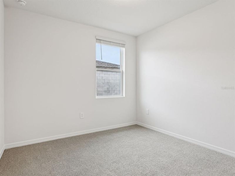 Spacious, unfurnished interior of a new home in The Grove at Stuart Crossing - Classic Series, Bartow (Image 10).