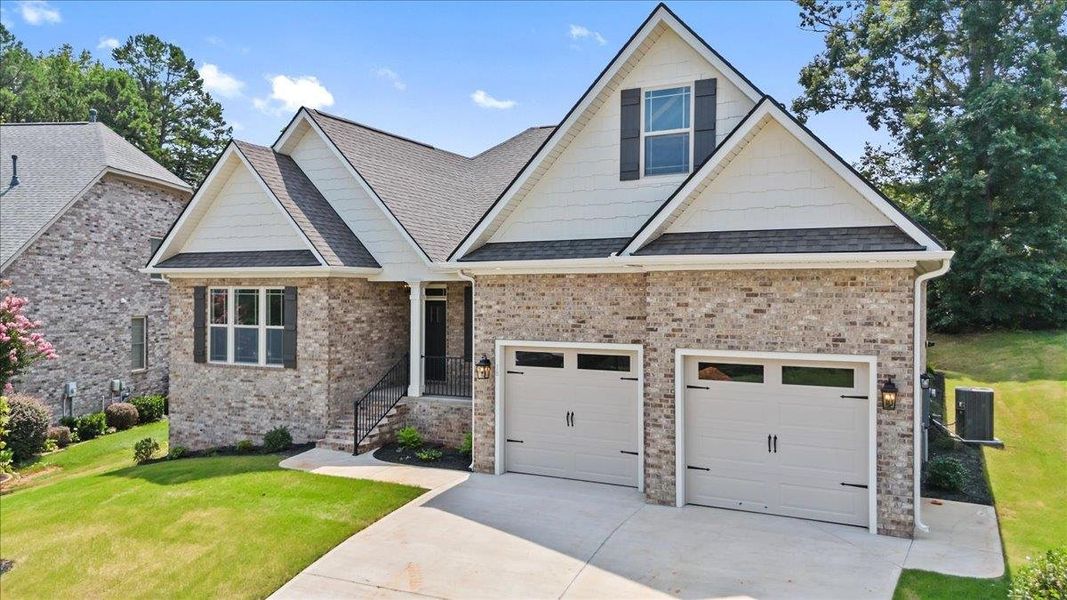 Front exterior of a new home in Lakeside at Blue Ridge Plantation, Taylors, SC, highlighting curb appeal (Image 16).