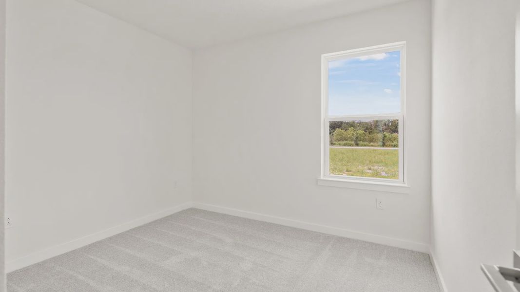 Furnished interior view inside a new home in Grasslands West, Lakeland (Image 17).