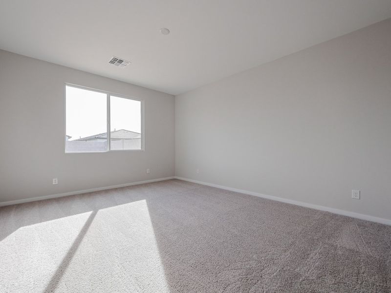 A room with a window and carpet. A room with a window and carpet.