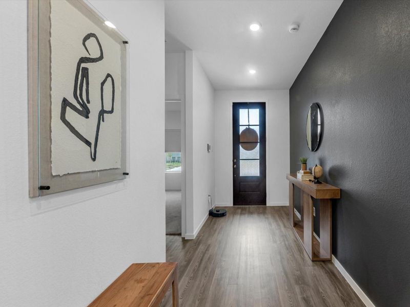 Foyer entry with 3 secondary bedrooms and 2 full baths in the front of the home