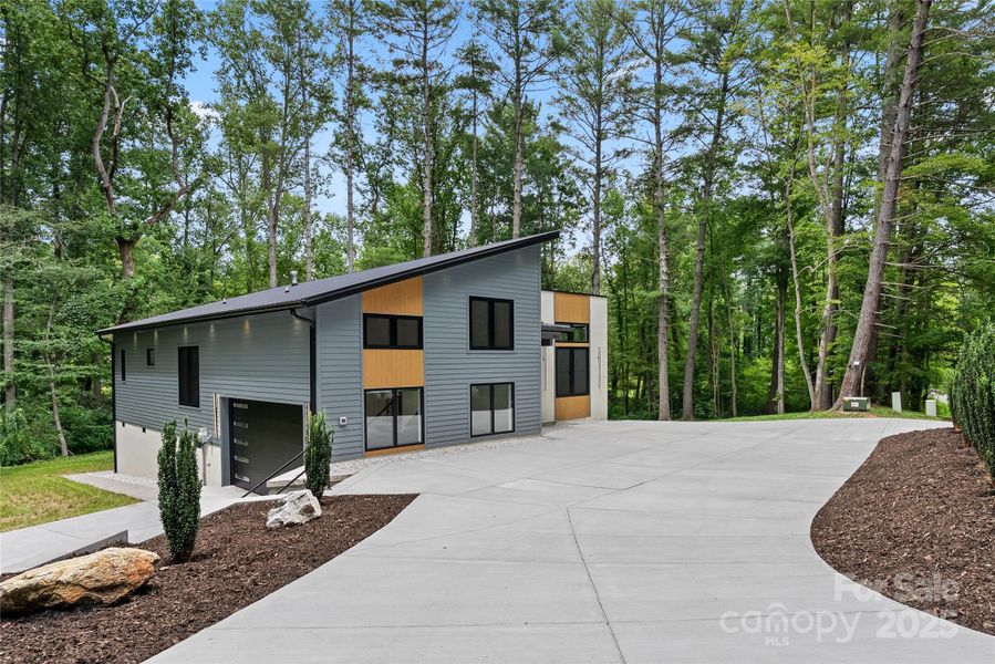 Front exterior of a new home in , Arden, NC, highlighting curb appeal (Image 22).