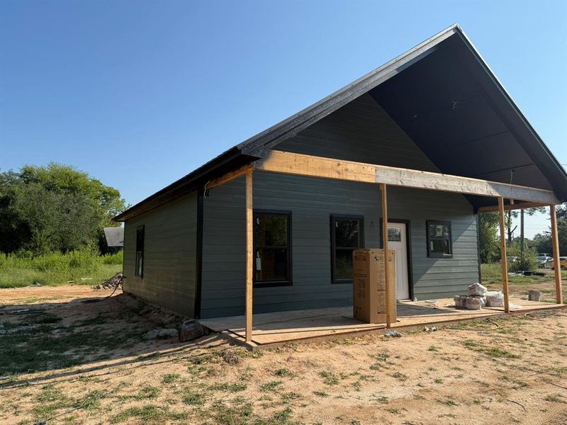 Rear view of property with a patio