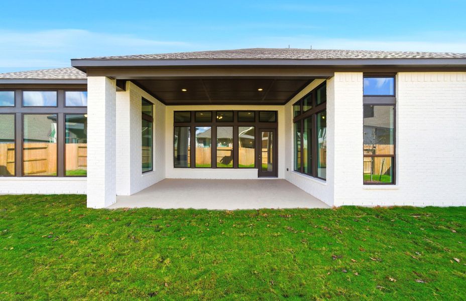 Exterior details and patio area of a home in Artavia 70′, Conroe (Image 3).