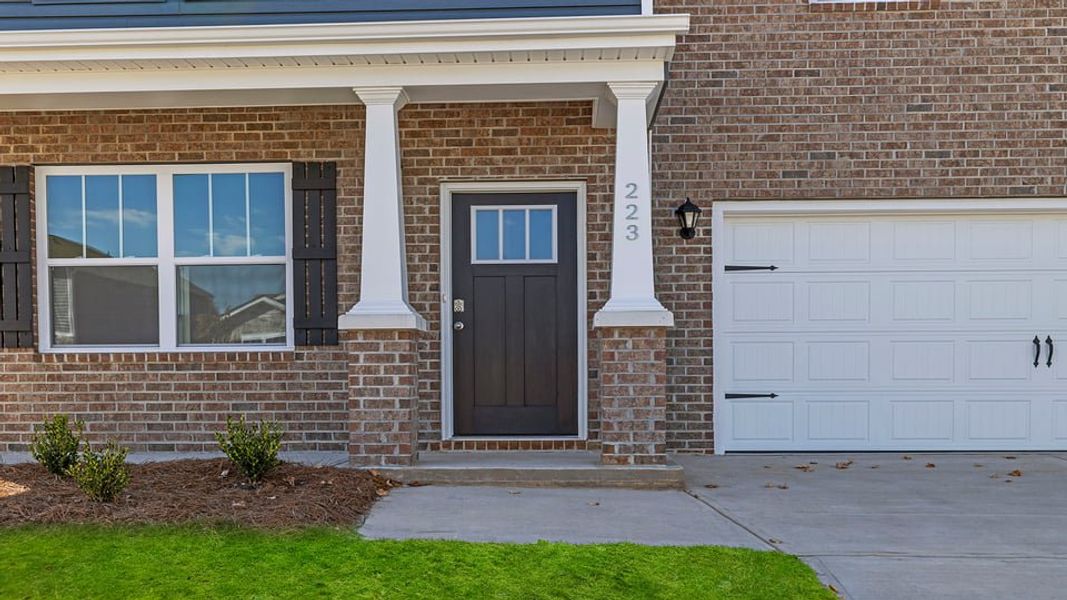 Exterior details and patio area of a home in Durbin Meadows Traditions, Fountain Inn (Image 4).