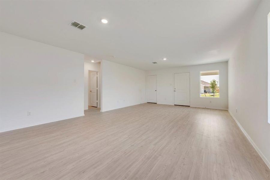 Empty room featuring light wood-type flooring