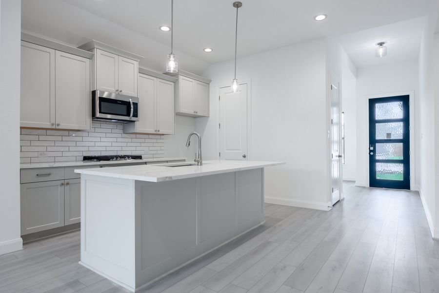 Representative furnished interior of a home built from the Elias by Risewell Homes in Sunterra, Katy (Image 4). Representative furnished interior of a home built from the Elias by Risewell Homes in Sunterra, Katy (Image 4).