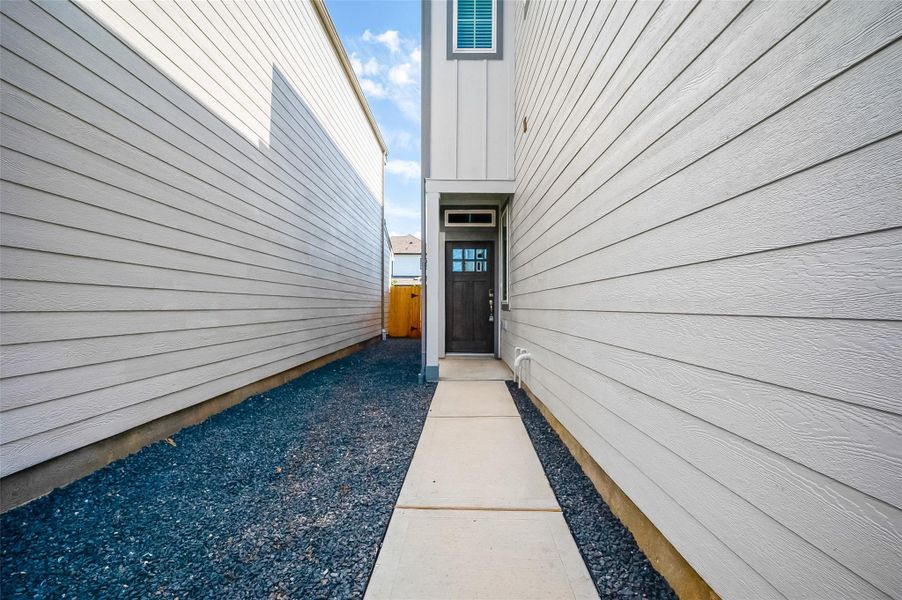 Front exterior of a new home in McClendon Park Village, Houston, TX, highlighting curb appeal (Image 28). Front exterior of a new home in McClendon Park Village, Houston, TX, highlighting curb appeal (Image 28).
