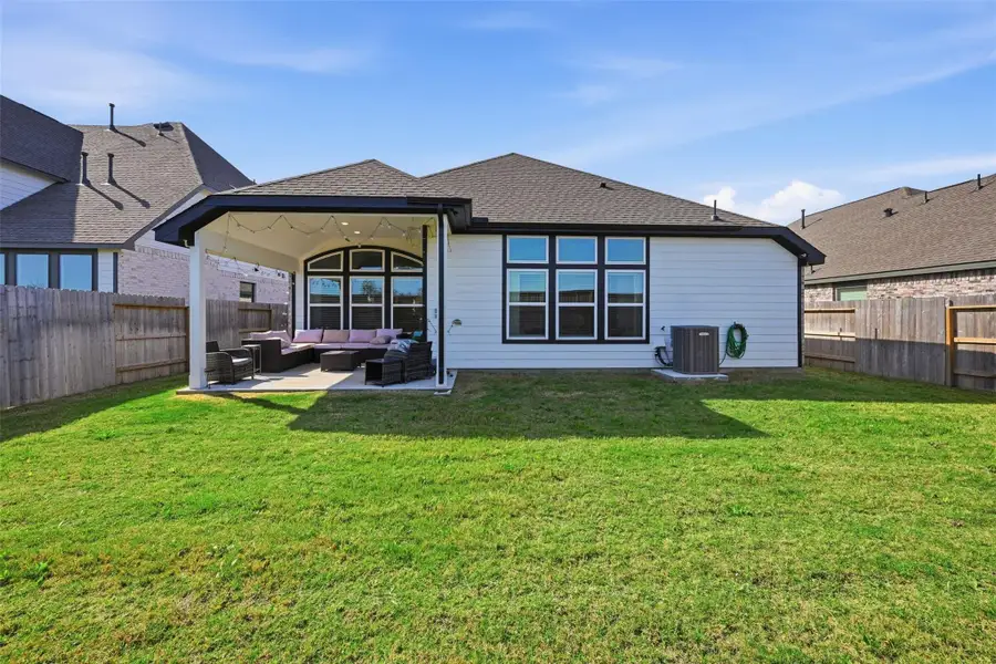 Exterior details and patio area of a home in Oakwood Estates, Waller (Image 3).