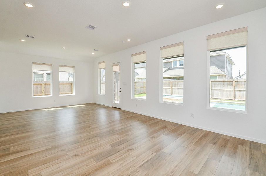 Open concept- breakfast/dining room and family room with GREAT views of the salt water pool! Remote controlled blinds on all windows- control how much or how little nautral light you want to shine through!