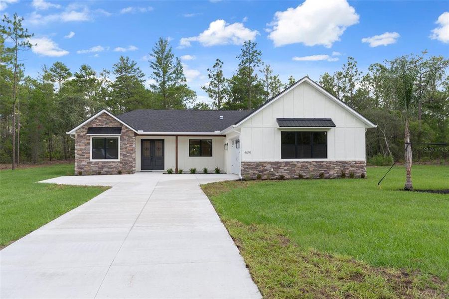 Front exterior of a new home in , Beverly Hills, FL, highlighting curb appeal (Image 28). Front exterior of a new home in , Beverly Hills, FL, highlighting curb appeal (Image 28).