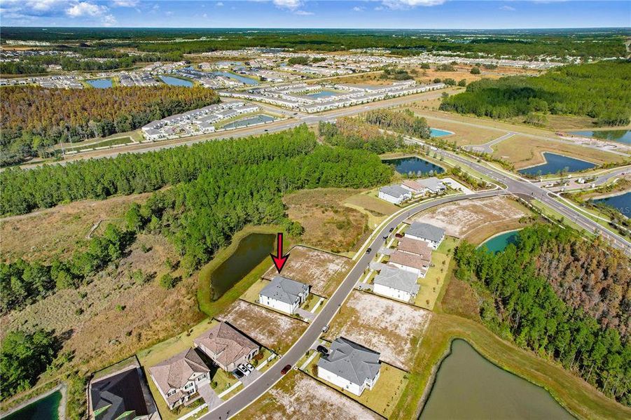 Front exterior of a new home in Shortgrass at Two Rivers, Zephyrhills, FL, highlighting curb appeal (Image 32). Front exterior of a new home in Shortgrass at Two Rivers, Zephyrhills, FL, highlighting curb appeal (Image 32).