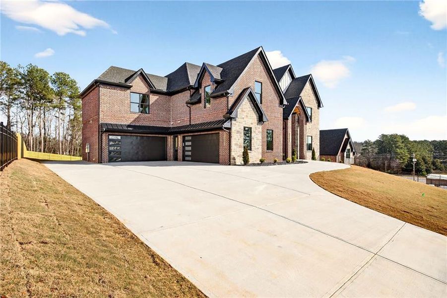 Front exterior of a new home in , Buford, GA, highlighting curb appeal (Image 32).