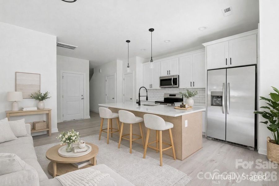 Kitchen with island and the refrigerator is included!  Virtually Staged Photo
