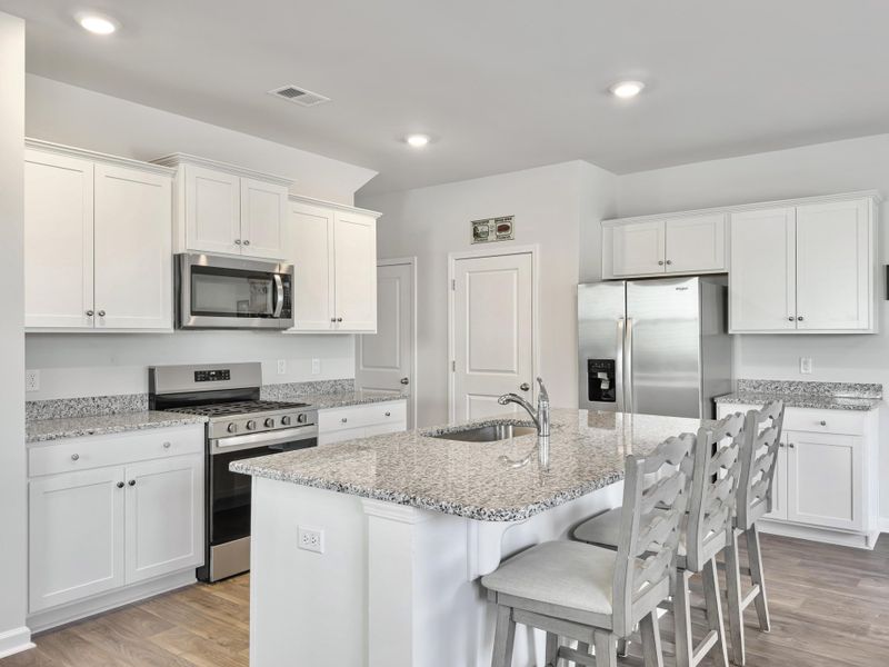 Furnished interior view inside a new home in Pine Hills at Cane Bay, Summerville (Image 9). Furnished interior view inside a new home in Pine Hills at Cane Bay, Summerville (Image 9).