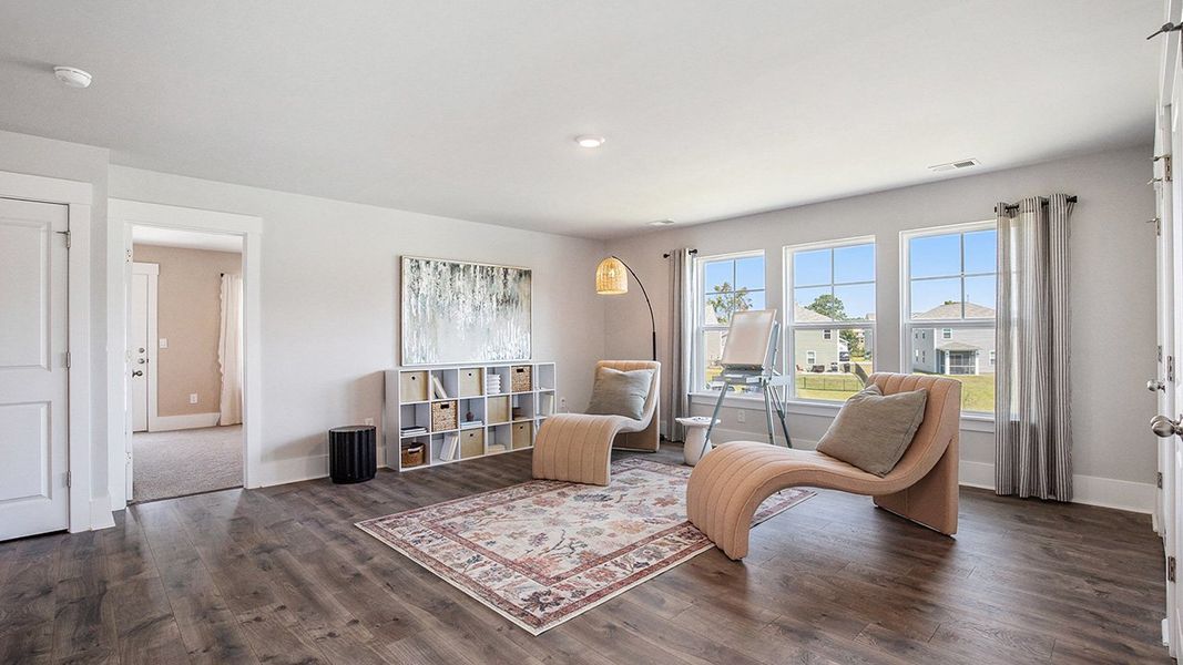 Representative furnished interior of a home built from the HARBOR OAK by D.R. Horton in The Forest at Black Bear, Longs (Image 11).