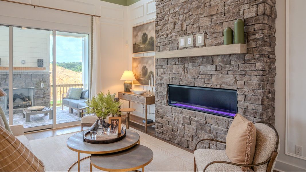 Gathering room with fireplace and access to staircase Gathering room with fireplace and access to staircase