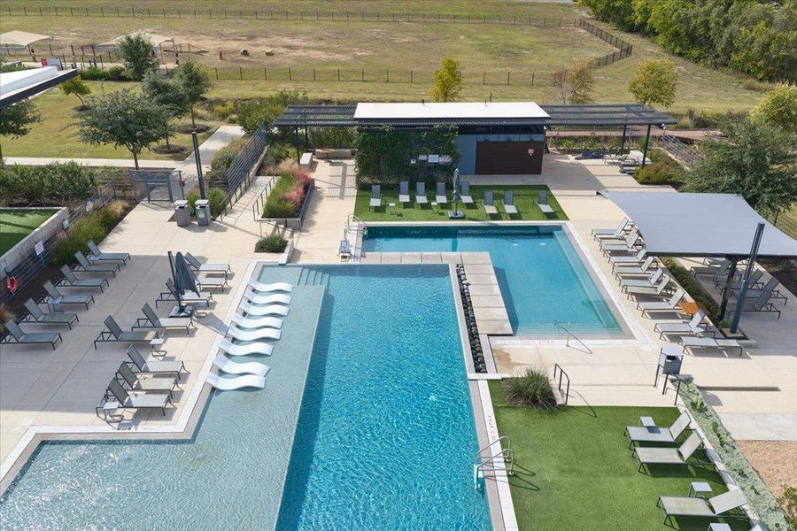 Community pool with a patio, a view of rural / pastoral area, and a pergola Community pool with a patio, a view of rural / pastoral area, and a pergola