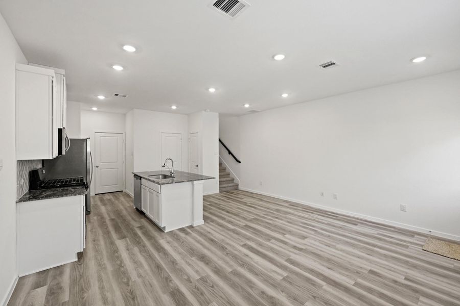 Furnished interior view inside a new home in Bridges on Lake Houston Villas, Humble (Image 11).