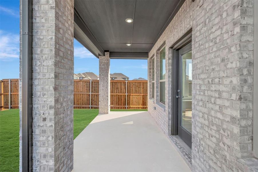 Exterior details and patio area of a home in Lily Creek at Sutton Fields, Aubrey (Image 3). Exterior details and patio area of a home in Lily Creek at Sutton Fields, Aubrey (Image 3).