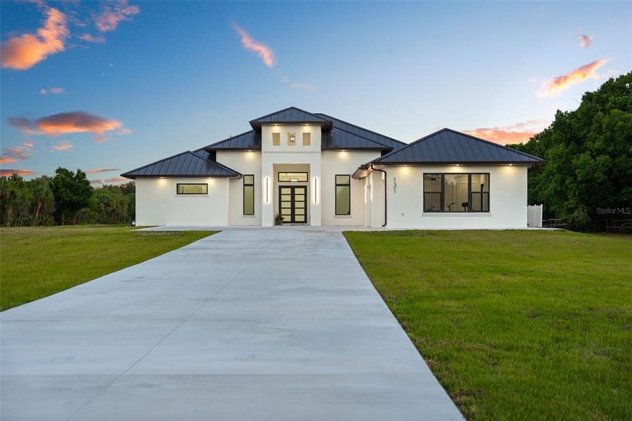Front exterior of a new home in , Palm Bay, FL, highlighting curb appeal (Image 2). Front exterior of a new home in , Palm Bay, FL, highlighting curb appeal (Image 2).