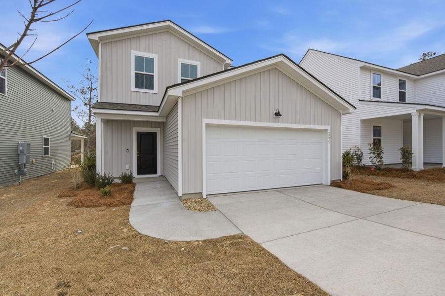 Front exterior of a new home in Grand Arbor, Blythewood, SC, highlighting curb appeal (Image 18).