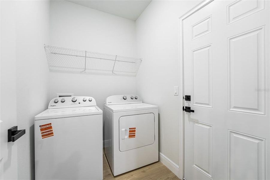 The pictures are from a different house but feature the same floor plan and finishes.