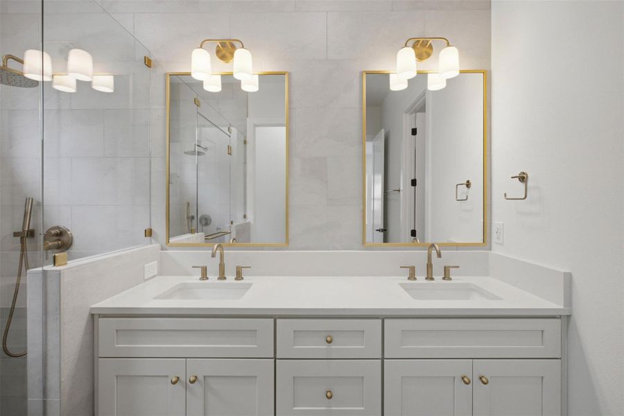 Dual sinks tile to the ceiling Dual sinks tile to the ceiling