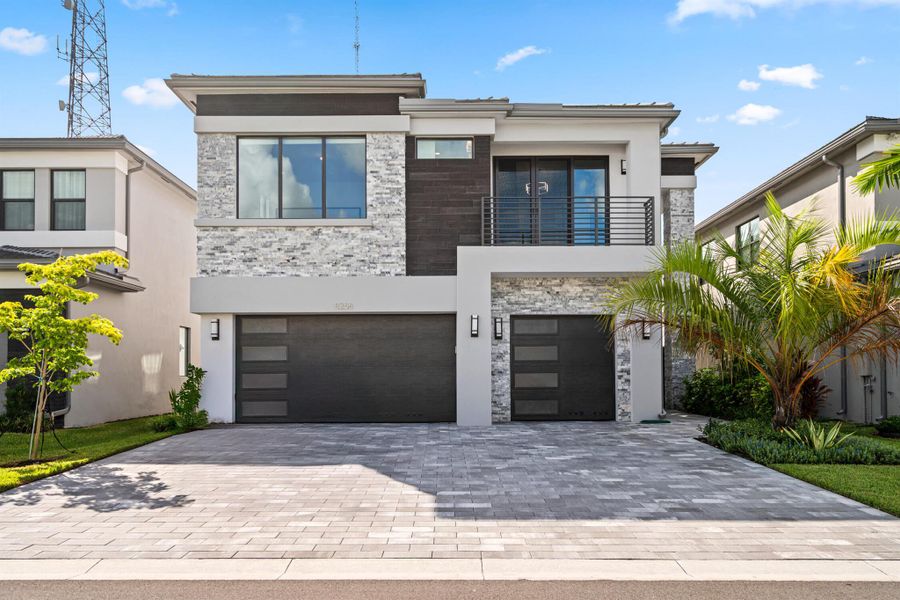 Front exterior of a new home in , Boca Raton, FL, highlighting curb appeal (Image 24). Front exterior of a new home in , Boca Raton, FL, highlighting curb appeal (Image 24).