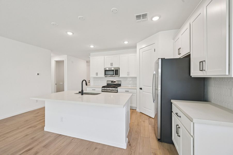 Kitchen featuring the Harmony Collection. Finishes and options may vary by community.