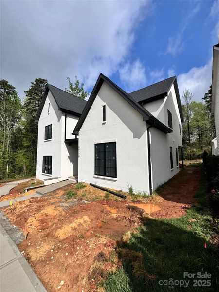 Front exterior of a new home in , Davidson, NC, highlighting curb appeal (Image 7).