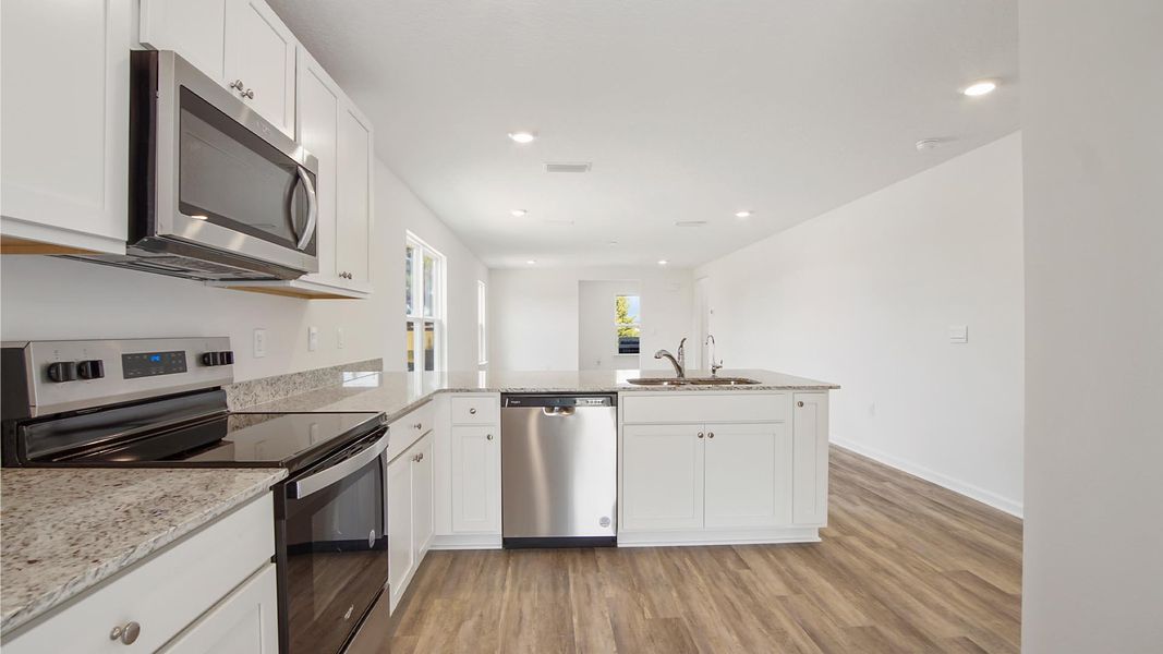 Representative furnished interior of a home built from the Inzer by D.R. Horton in Owl's Head East, Freeport (Image 7). Representative furnished interior of a home built from the Inzer by D.R. Horton in Owl's Head East, Freeport (Image 7).