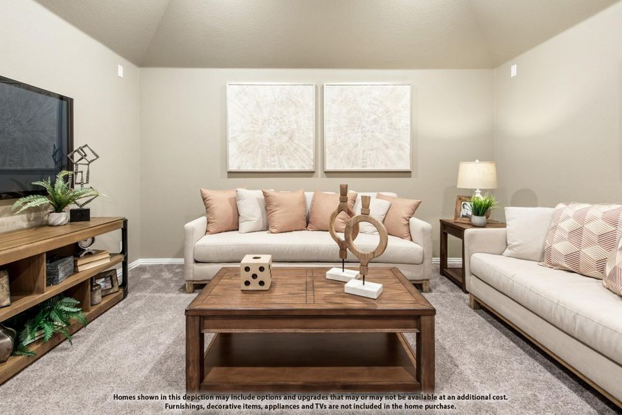 Living room with two beige sofas, wood coffee table, wall art, and carpet flooring
