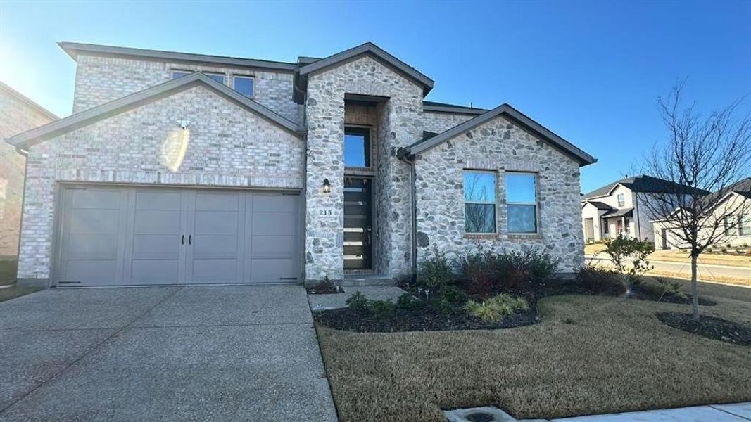 View of front of home with a garage