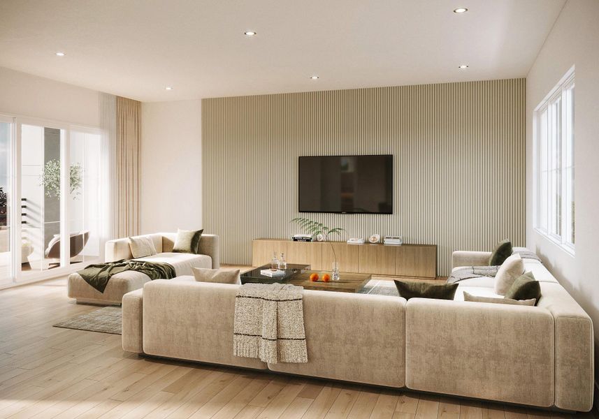 The living area is designed with a sense of scale and understated elegance, featuring wide-plank flooring, recessed lighting, and a striking custom slatted accent wall that anchors the space. Expansive windows and sliding glass doors invite abundant natural light while creating a seamless connection to the outdoors. Clean lines, warm textures, and thoughtful proportions make this living space ideal for both relaxed daily living and elevated entertaining, reflecting the home’s high level of design.