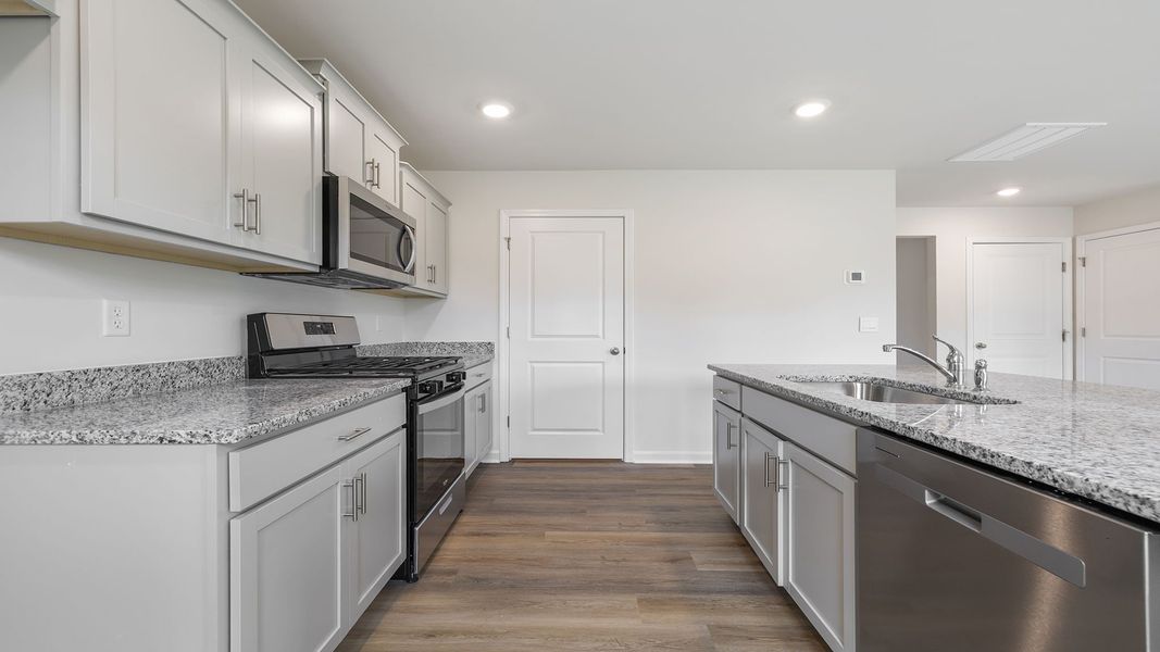 Furnished interior view inside a new home in Bentley Park, Greenwood (Image 9).