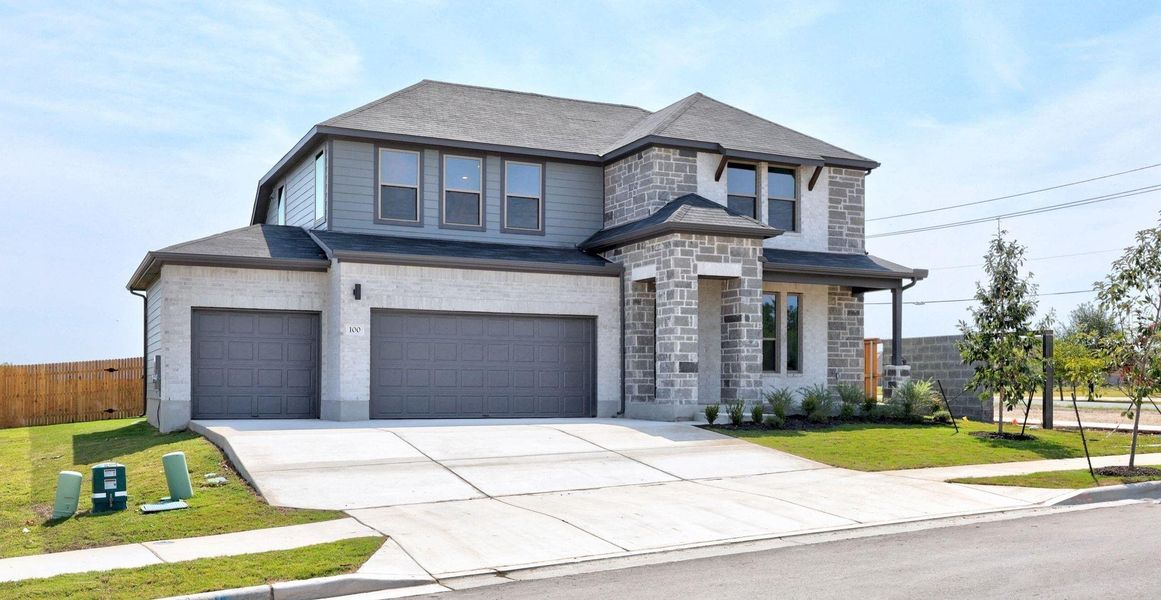 Front exterior of a new home in Prairie Winds, Hutto, TX, highlighting curb appeal (Image 1). Front exterior of a new home in Prairie Winds, Hutto, TX, highlighting curb appeal (Image 1).