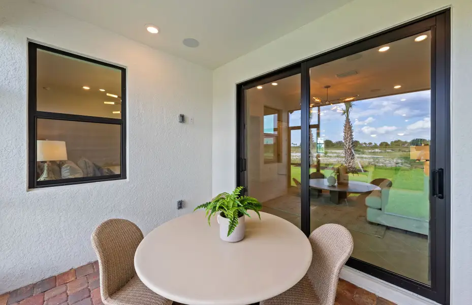 Exterior details and patio area of a home in Del Webb Naples, Ave Maria (Image 3).