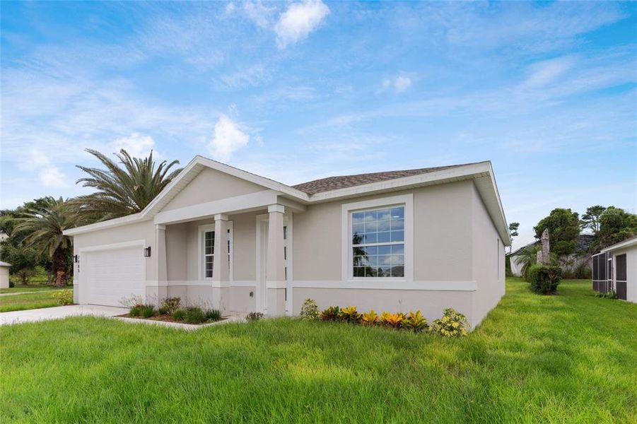 Front exterior of a new home in , Kissimmee, FL, highlighting curb appeal (Image 31).