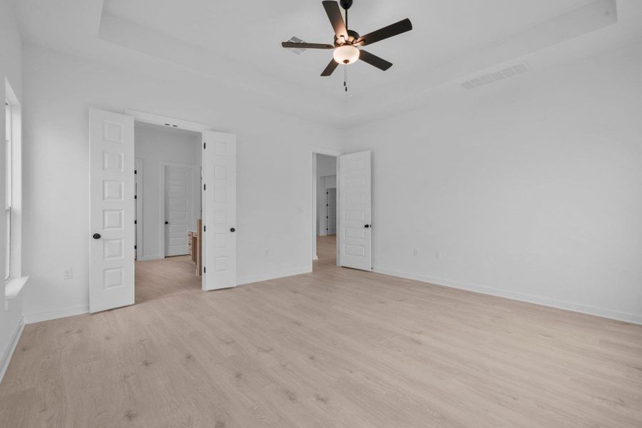 Primary Bedroom with tray ceiling