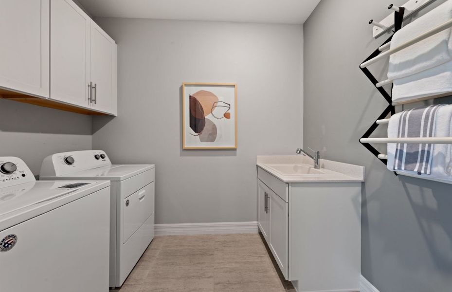 Representative furnished interior of a home built from the Whitestone by DiVosta in The Reserve at Eastpointe, Palm Beach Gardens (Image 23).