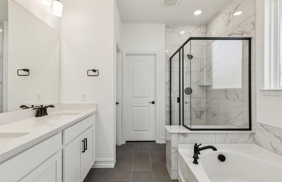 Owner's bath with double vanity and spacious shower *Real home pictured *Real home pictured